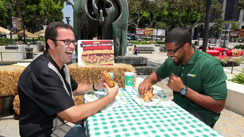 Illustration for article titled Arian Foster Stays In Shape By Riding A Mechanical Bull While Jared From Subway Looks On